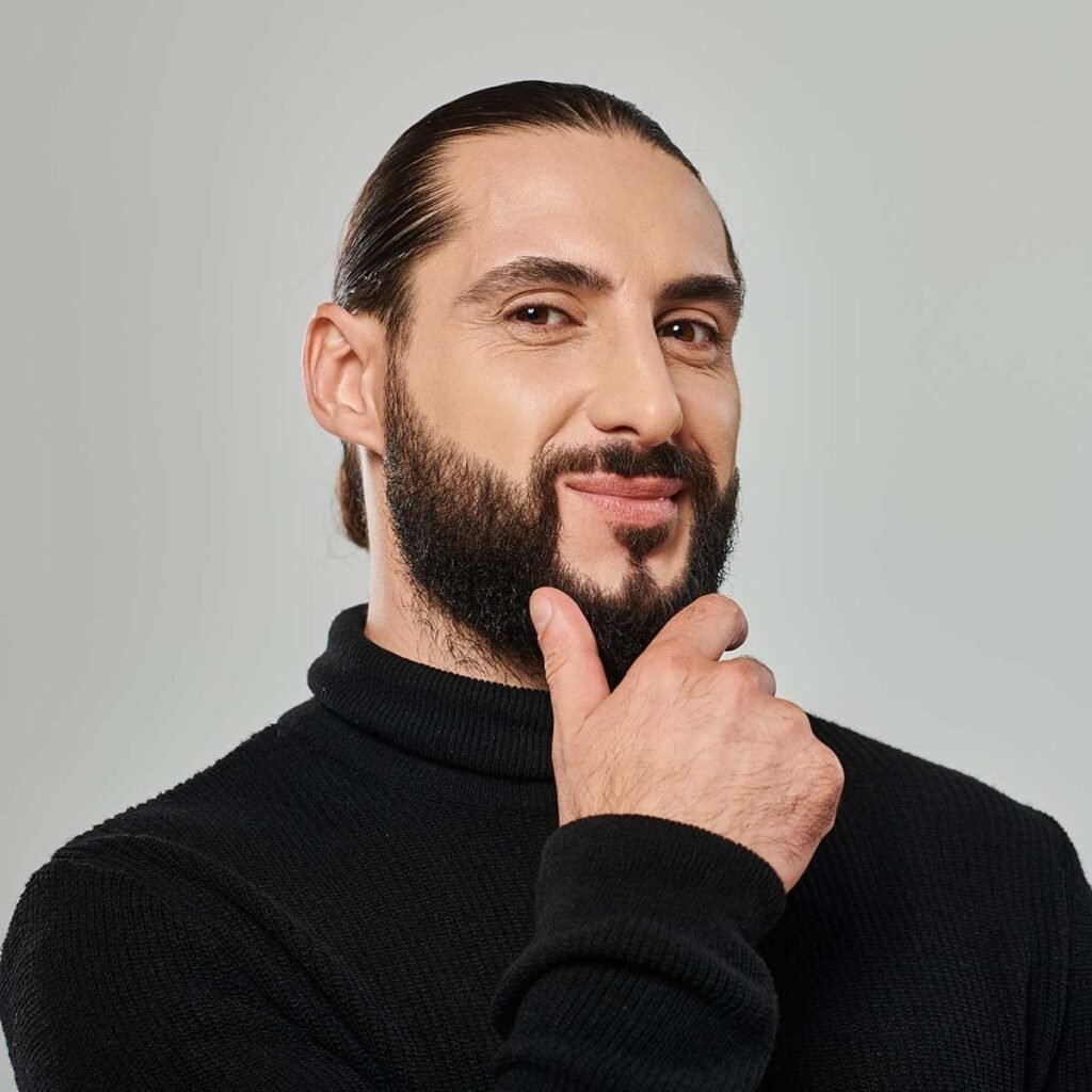 portrait of good looking arabic man in turtleneck HNZS2UB